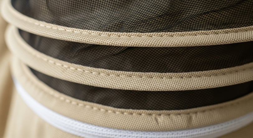Detailed stitching and ventilated mesh layers in a premium bee suit.