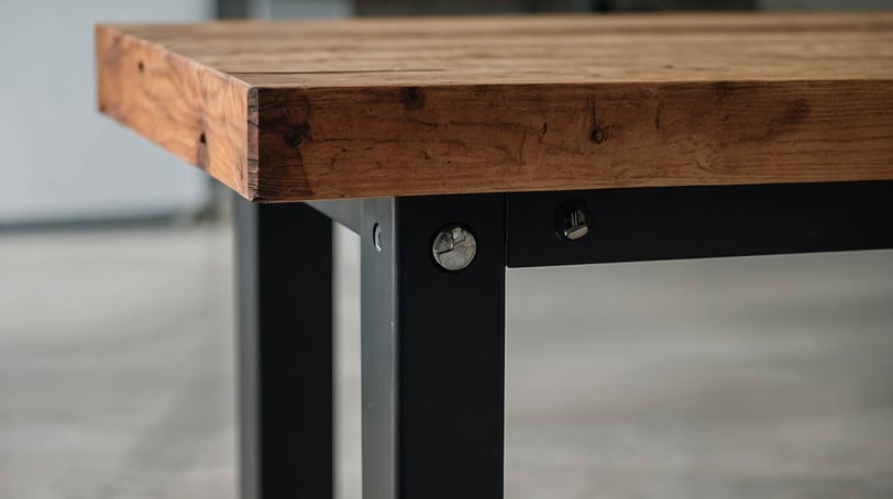 a wooden workbench with metal legs