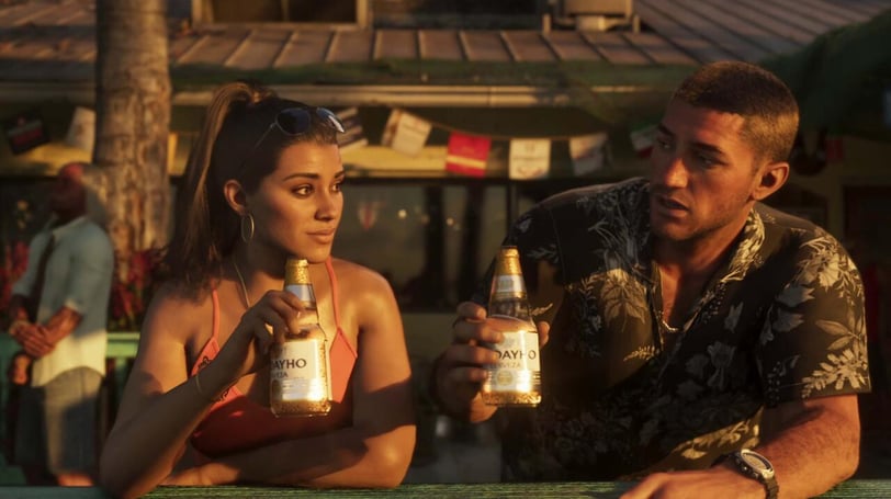 a man and woman sitting at a table with beer