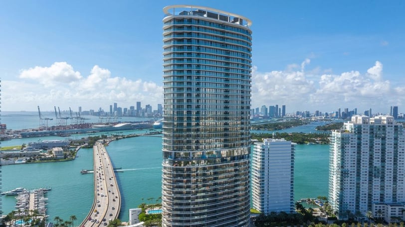 Panoramic view of Miami skyline with Five Park residential tower in foreground.