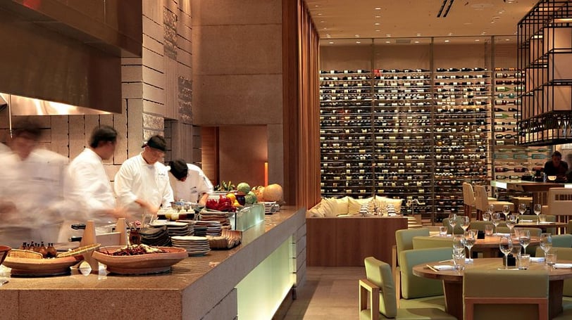 a restaurant with chefs and chefs in the background