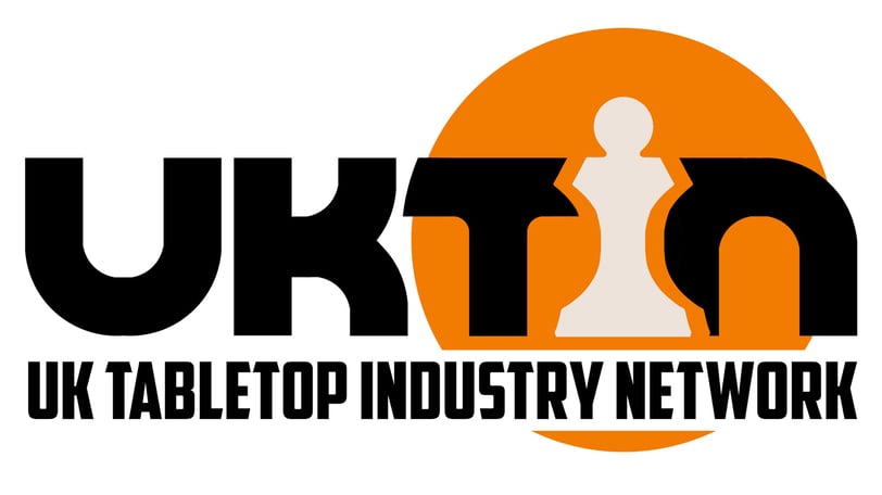 A logo for UK TIN. An orange circle frames "TIN", with the I replaced by a pawn.
