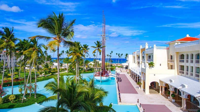 Luxury Punta Cana resort with palm trees, pools, and ocean views in the Dominican Republic
