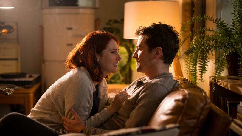 a man and woman sitting on a couch
