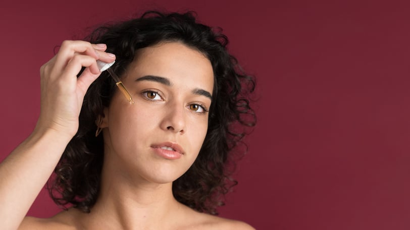 applying under eye serum