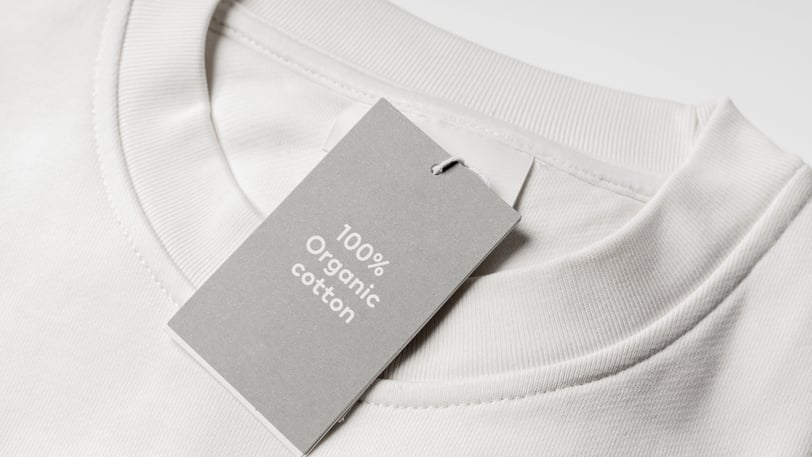 white t-shirt with tag that says '100% organic cotton'