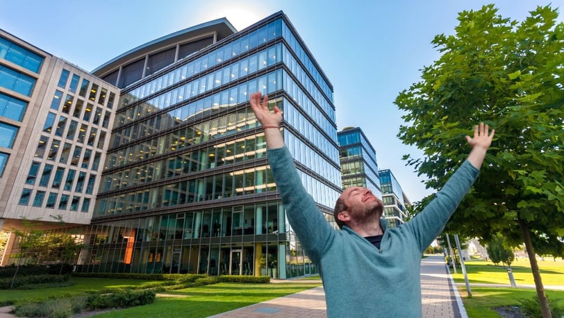 man with arms in the air