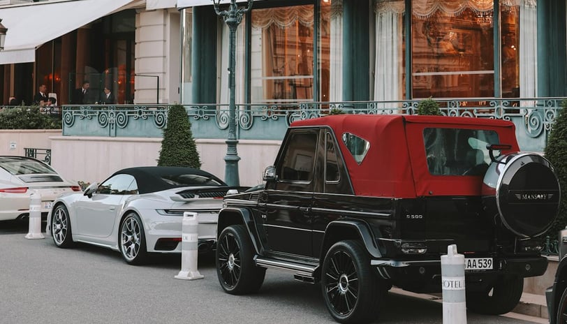 Luxury Cars Parked Outside Elegant Hotel Facade during Monaco Grand Prix