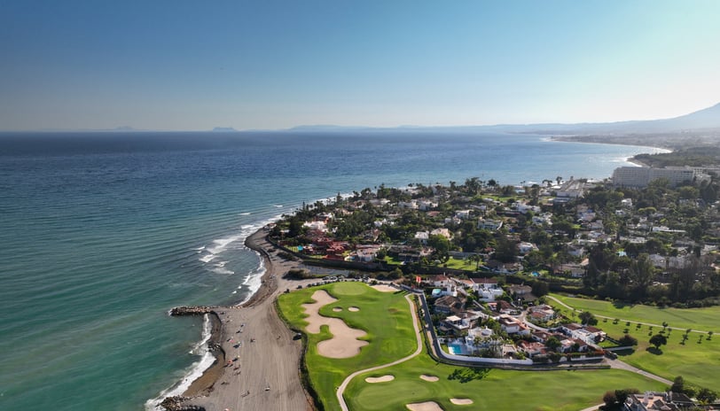a golf course in Marbella with a view of the sea