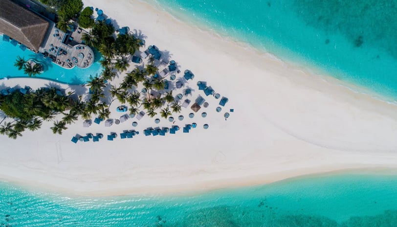 Tropical sandy island with hotel in Baa Atoll, Maldives
