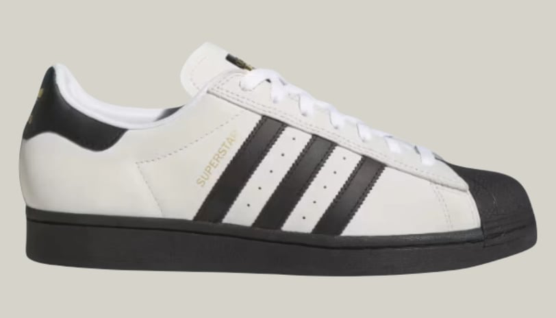 a white adidas sneakers with black and white stripes