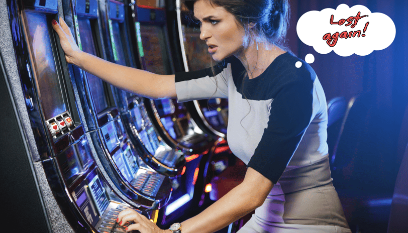 a woman playing a slot machine