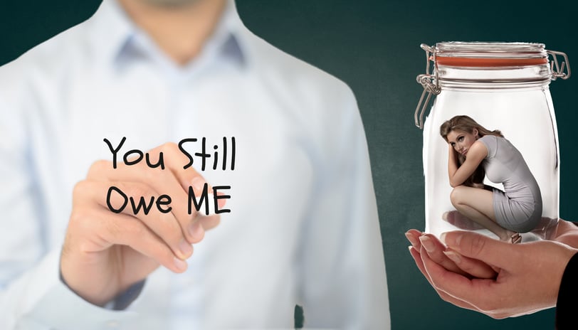 a woman holding a jar with a woman inside