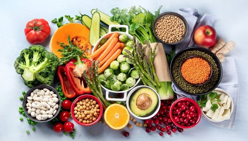 a variety of fruits and vegetables in bowls