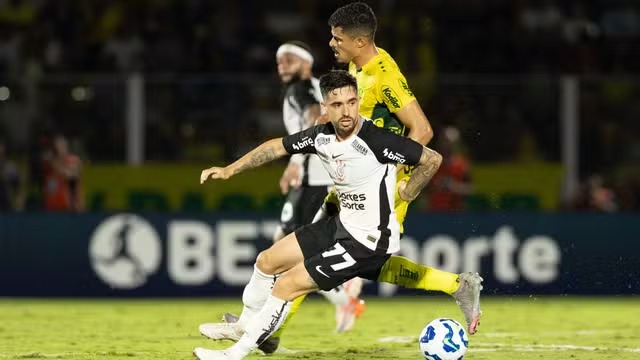 a soccer player is playing soccer on a field