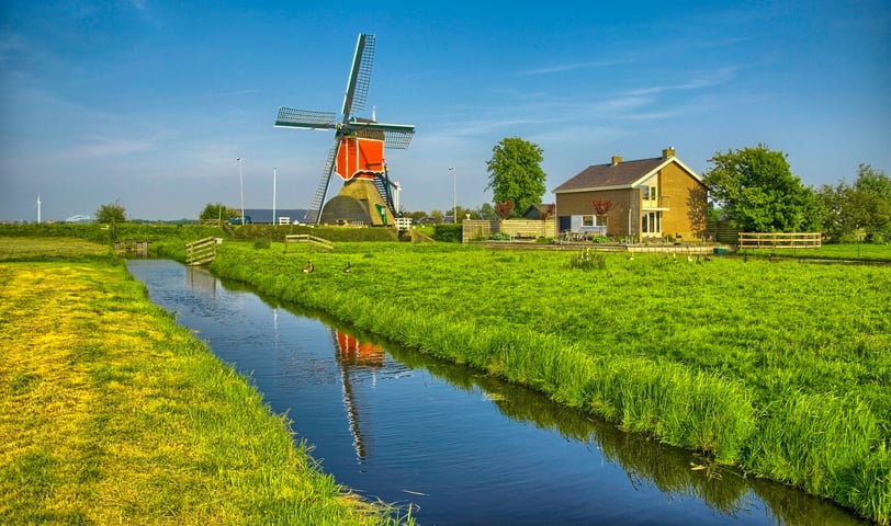 Windmills and water canal in Kinderdijk, Holland or Netherlands
