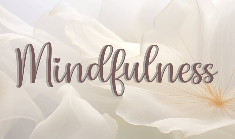 a white flower with the words mindfulness