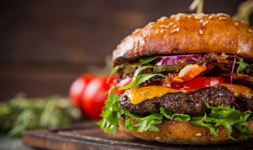 a hamburger with all of the trimmings