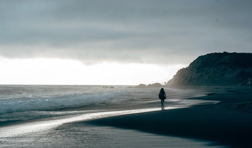 walking on the beach of california coastline