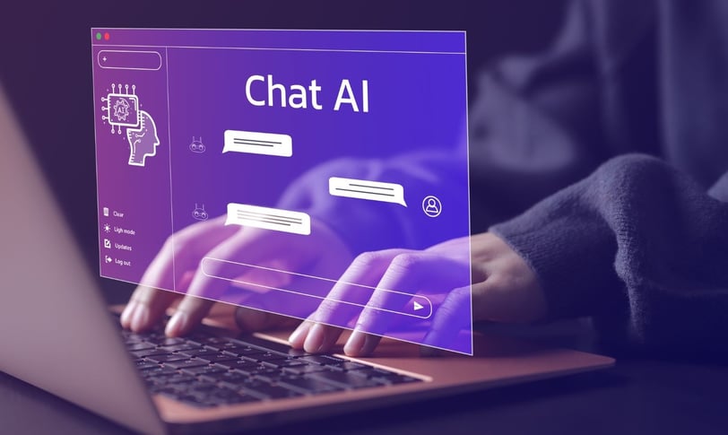 a person works on their laptop and interacts with Chat AI.