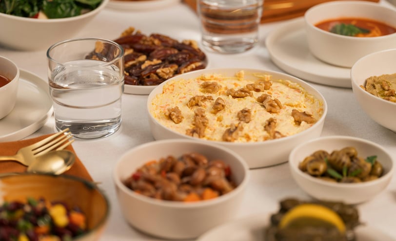 a table with bowls of food and drinks