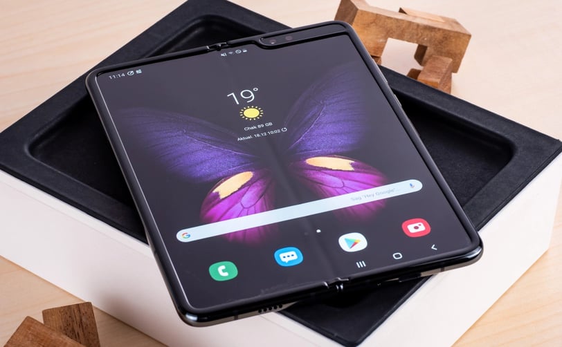 a samsung galaxy note 8 pro with a butterfly on top of it