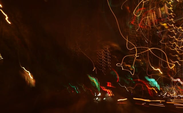 a blurry photo of a city street at night