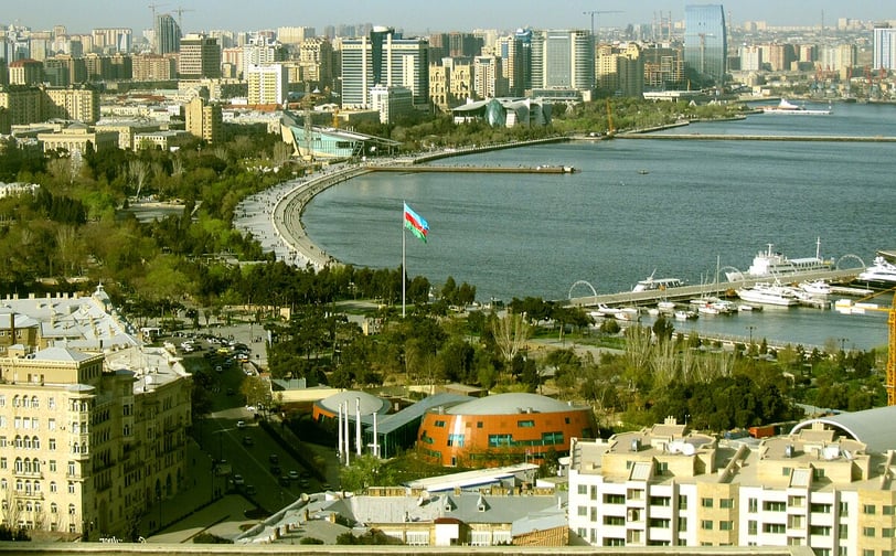 a view of a city with a flag flying in the air