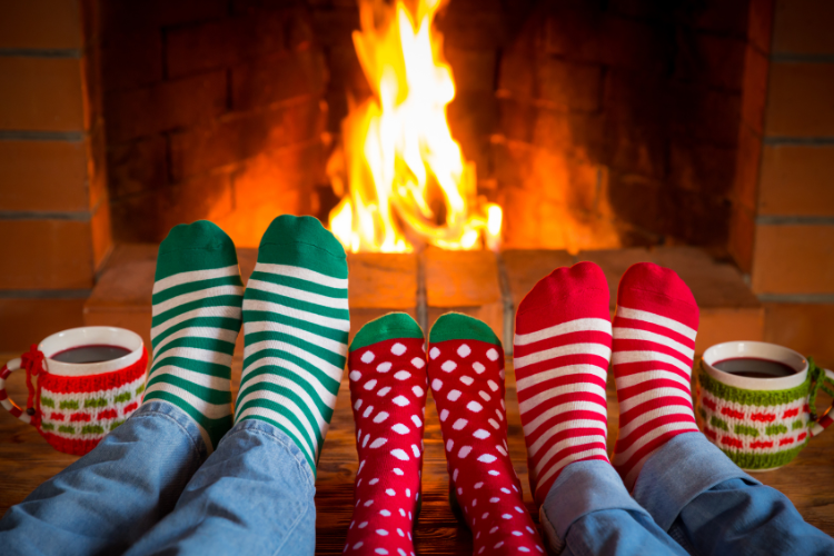 a couple of feet in socks with christmas stockings