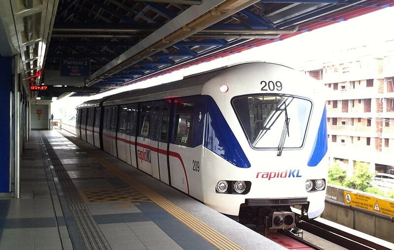 Light rail train at elevated station representing transit connectivity