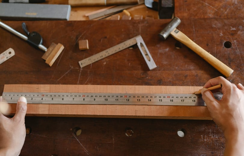 a person holding a ruler