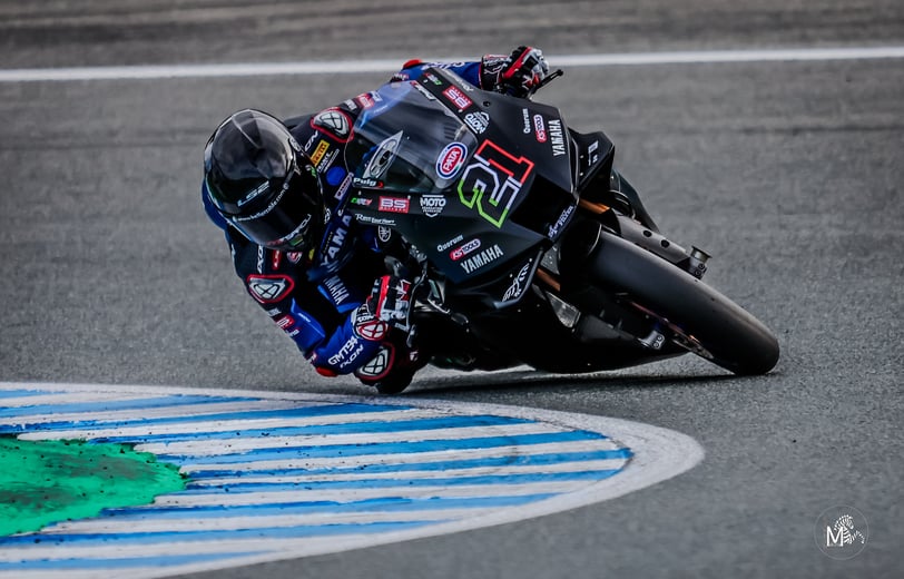 a person riding a motorcycle on a track