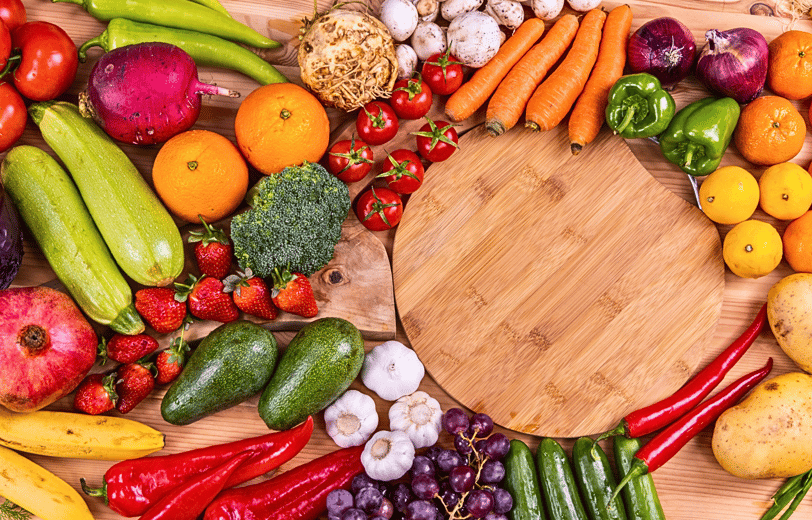 a wooden cutting board with vegetables and vegetables