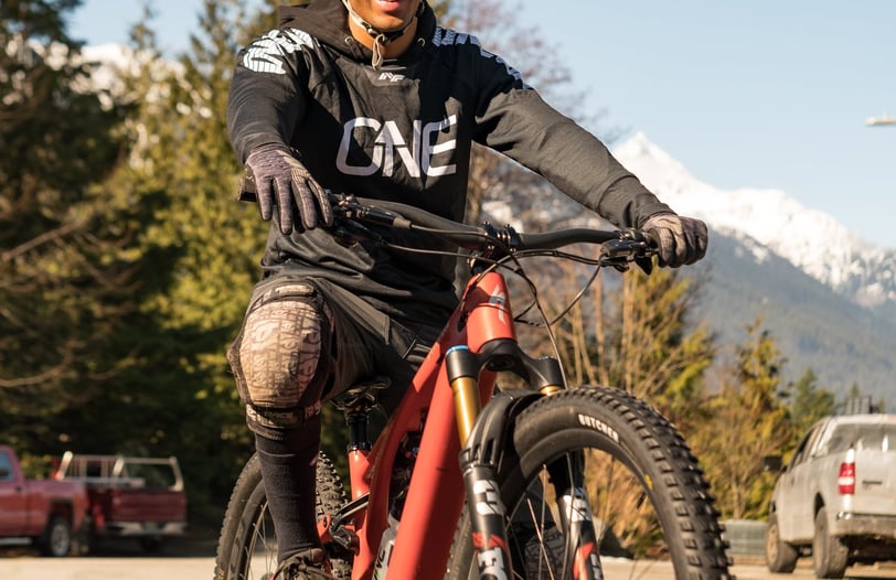 a man riding a bike on a road