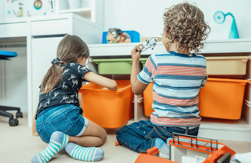 Two children learn through play.