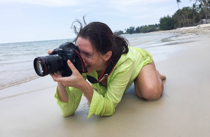 woman photographer on the beach of Koh Samui