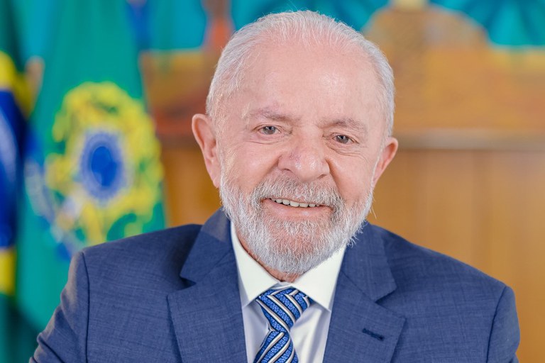 a man in a suit and tie with a blue tie lula