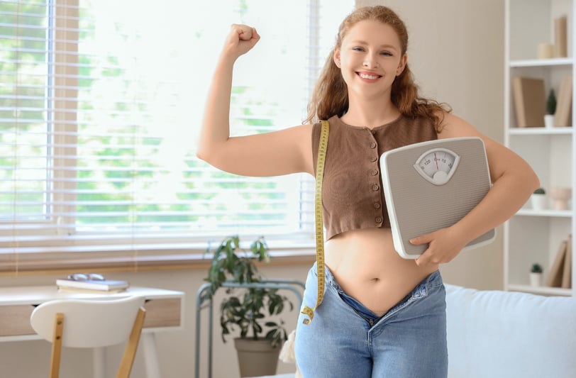 Happy, satisfied client achieving weight loss goals compassionate and evidence-based approach by GLEO Wellness Massachusetts