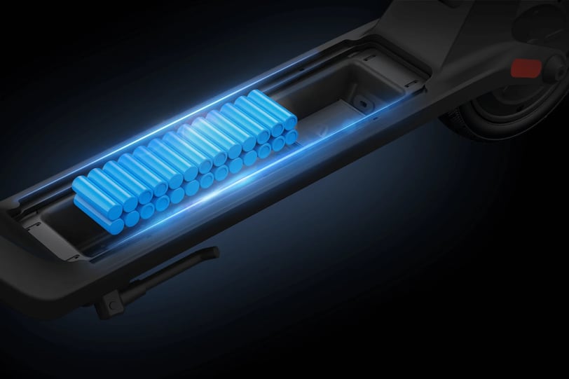 a blue and black electric scooter with a blue light