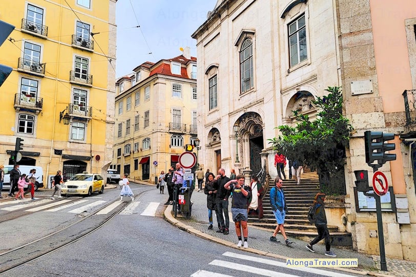 Beautiful street in Portugal with people going about their business 