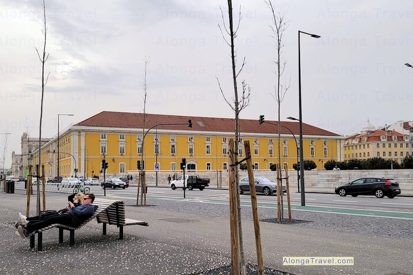 People relaxing on on a bench in an area of Lisbon built for relaxation during Pombaline reforms