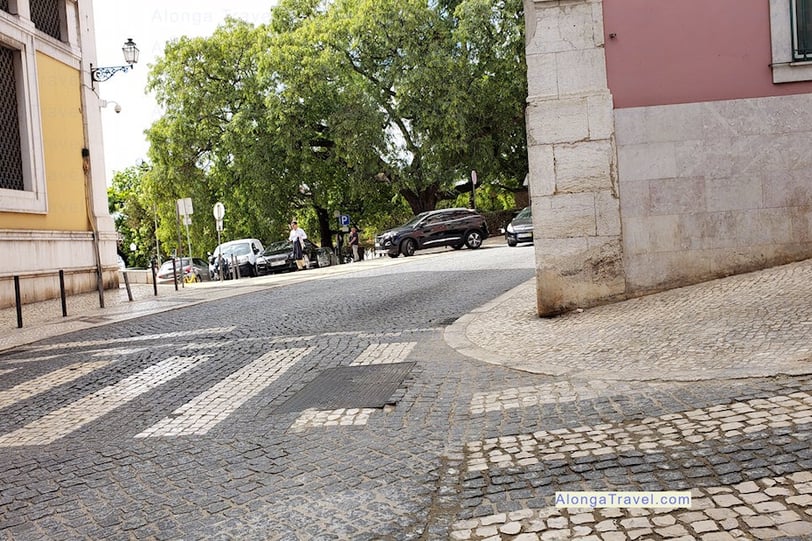 multicolored stones making pretty but slippery sidewalks in Portugal as a safety concern 