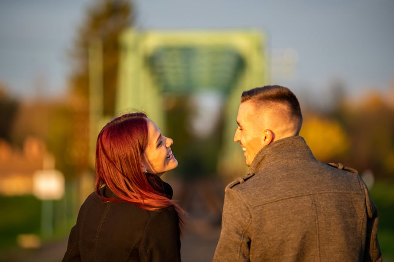 a man and woman standing next to each other