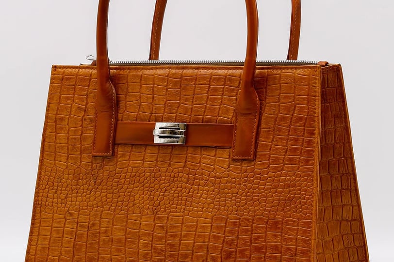 a brown leather handbag with a brown alligator skin by Heros Leather HN