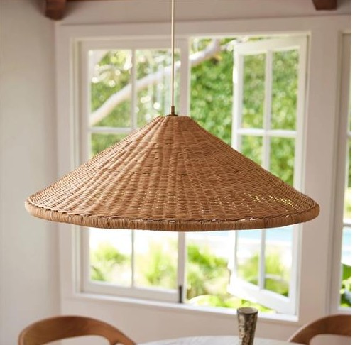Woven rattan pendant light in a cozy dining area, featured by Regal Touch Home.