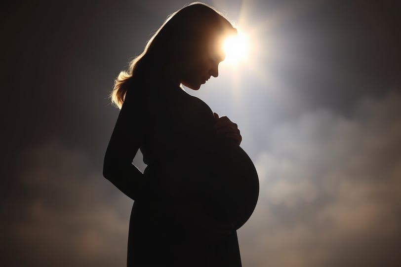 a pregnant woman is standing in the sun