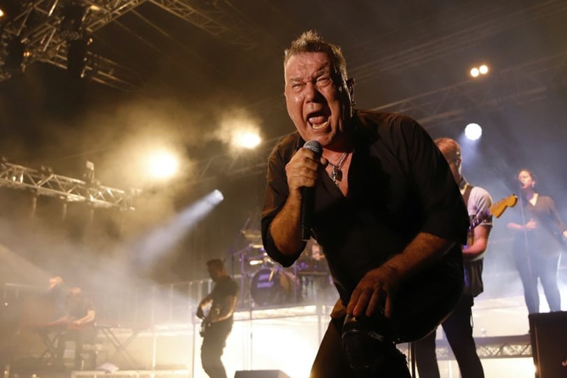 Photo of Jimmy Barnes singing live.