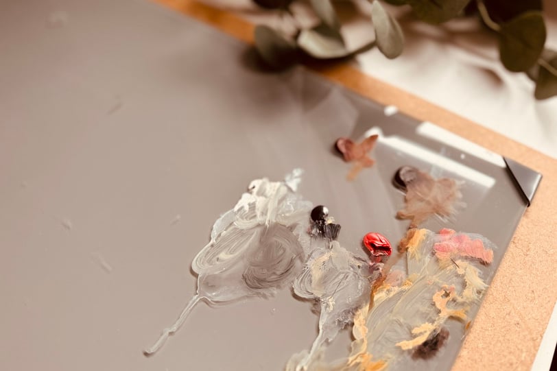 The grey glass palette I use in my painting process