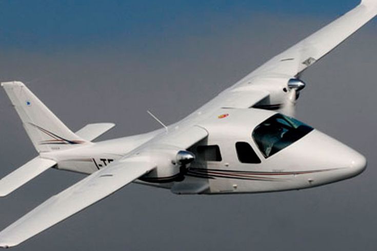 a small plane flying through the sky