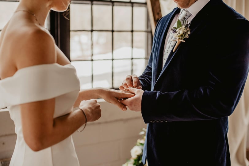 a man and woman getting married in a wedding ceremony